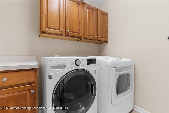 10889 Pointe W Blvd, Grand Ledge, MI 48837 - washroom with cabinet space and washer and dryer