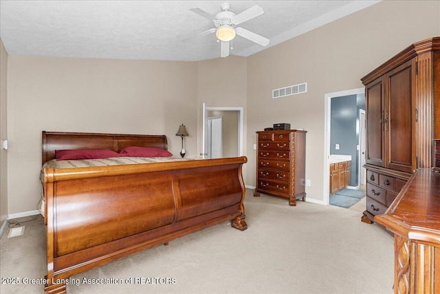 10889 Pointe W Blvd, Grand Ledge, MI 48837 - bedroom featuring light carpet, lofted ceiling, ensuite bathroom, a ceiling fan, and a textured ceiling