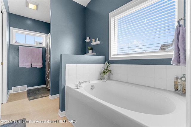 10889 Pointe W Blvd, Grand Ledge, MI 48837 - full bathroom featuring a bath and baseboards