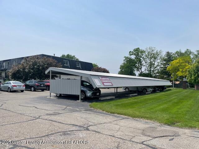 5535 W St Joe Hwy Unit B12, Lansing, MI 48917 - view of partially covered parking lot