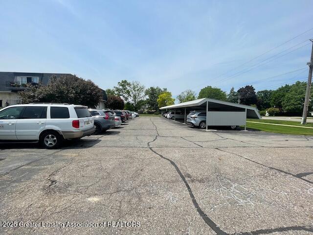 5535 W St Joe Hwy Unit B12, Lansing, MI 48917 - view of partially covered parking lot