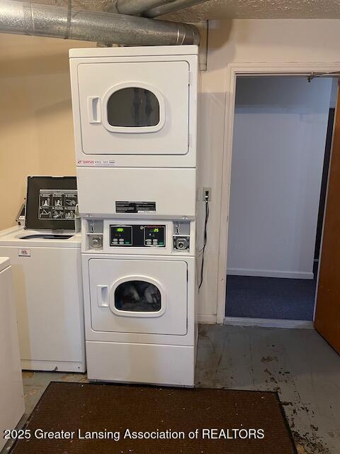 5535 W St Joe Hwy Unit B12, Lansing, MI 48917 - shared laundry featuring stacked washer / dryer and washing machine and clothes dryer