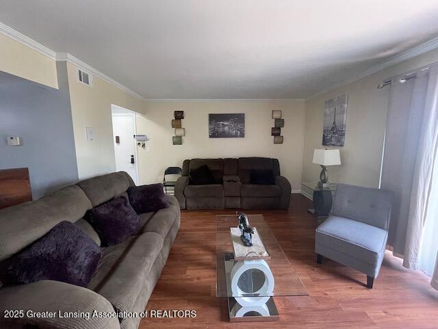 5535 W St Joe Hwy Unit B12, Lansing, MI 48917 - living room with light wood finished floors and crown molding