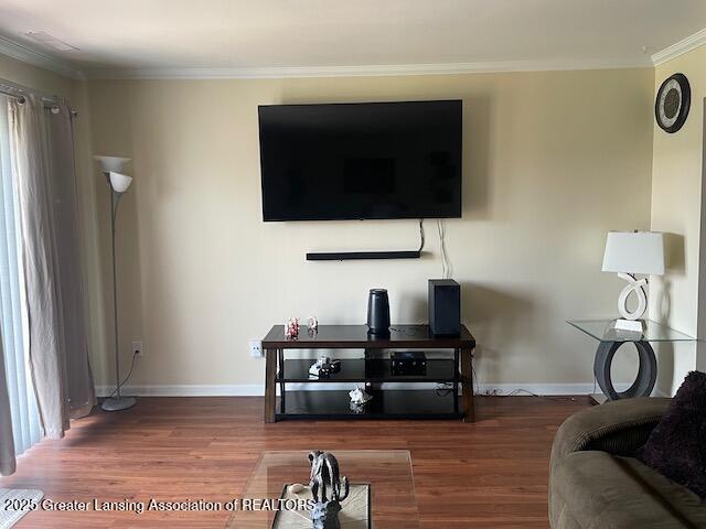 5535 W St Joe Hwy Unit B12, Lansing, MI 48917 - living room with wood finished floors and ornamental molding