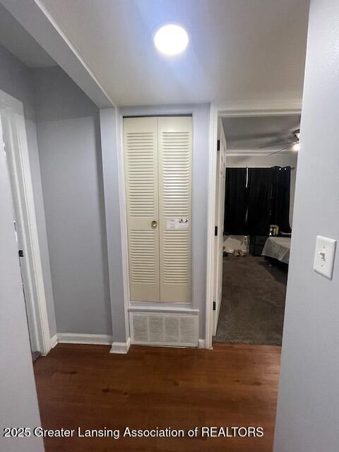 5535 W St Joe Hwy Unit B12, Lansing, MI 48917 - hallway featuring wood finished floors and baseboards