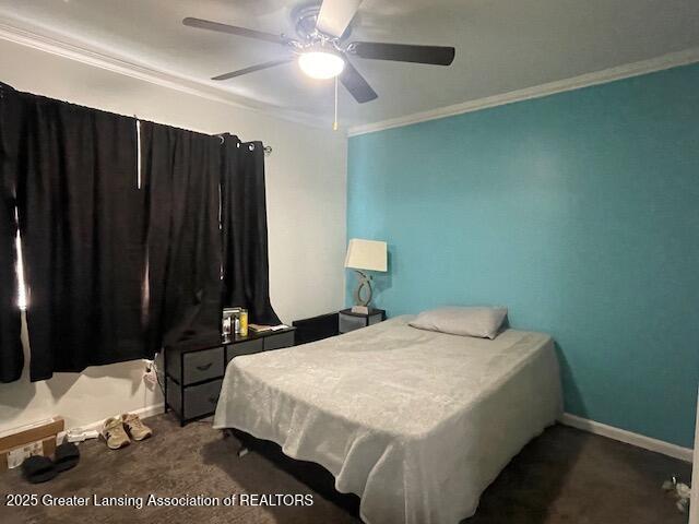 5535 W St Joe Hwy Unit B12, Lansing, MI 48917 - bedroom featuring crown molding, a ceiling fan, and carpet floors