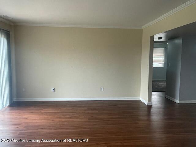 5535 W St Joe Hwy Unit B12, Lansing, MI 48917 - unfurnished room featuring dark wood finished floors and crown molding