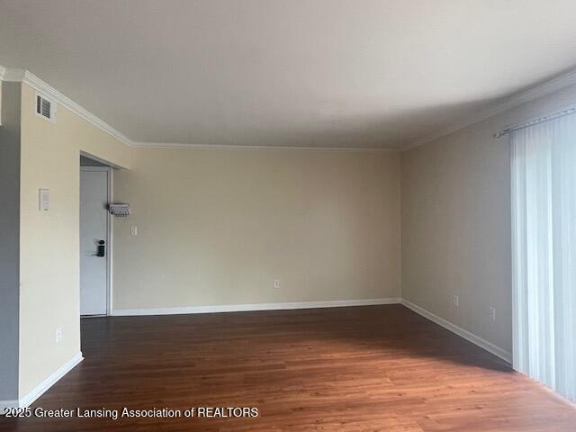 5535 W St Joe Hwy Unit B12, Lansing, MI 48917 - unfurnished room with wood finished floors and crown molding