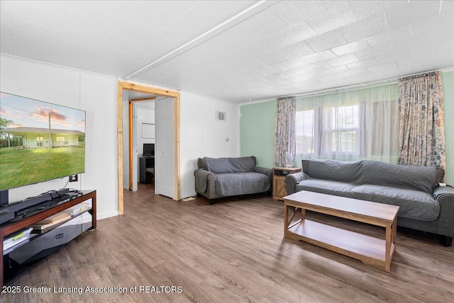 2243 Hubbard Rd, Charlotte, MI 48813 - living area with wood finished floors and ornamental molding
