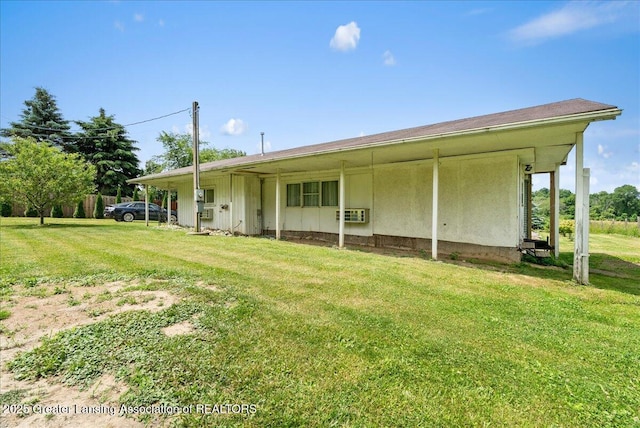 2243 Hubbard Rd, Charlotte, MI 48813 - rear view of property featuring a yard