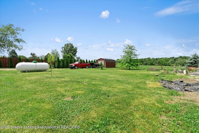 2243 Hubbard Rd, Charlotte, MI 48813 - view of green lawn with an outbuilding