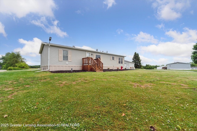 2744 Carlisle Hwy, Charlotte, MI 48813 - back of house with a yard
