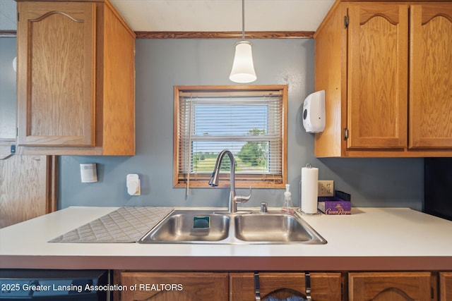2744 Carlisle Hwy, Charlotte, MI 48813 - kitchen featuring light countertops, brown cabinets, and hanging light fixtures