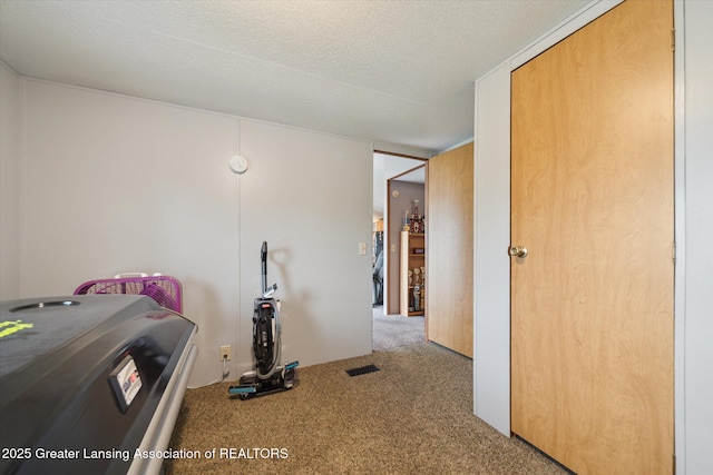 2744 Carlisle Hwy, Charlotte, MI 48813 - carpeted bedroom with a textured ceiling