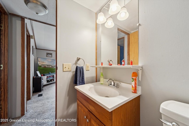 2744 Carlisle Hwy, Charlotte, MI 48813 - half bath with vanity and toilet