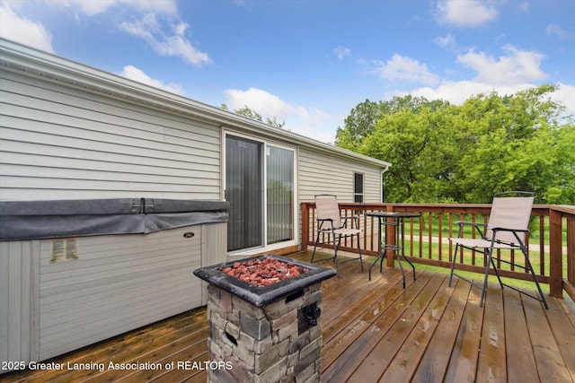 2744 Carlisle Hwy, Charlotte, MI 48813 - deck featuring a fire pit