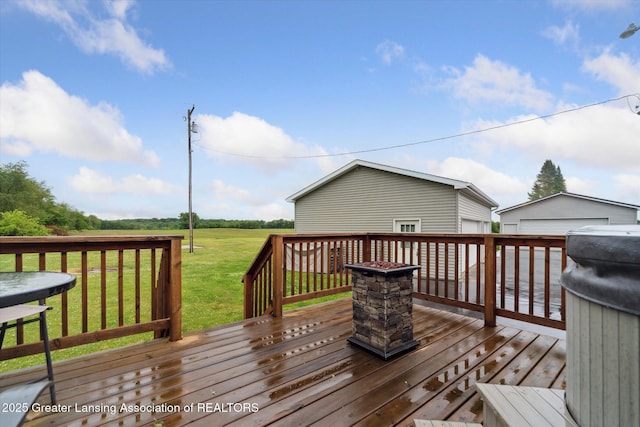 2744 Carlisle Hwy, Charlotte, MI 48813 - deck featuring a lawn and a garage