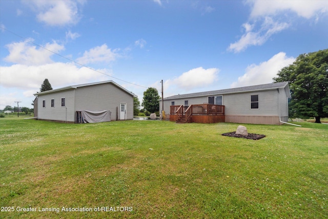 2744 Carlisle Hwy, Charlotte, MI 48813 - view of green lawn with a wooden deck