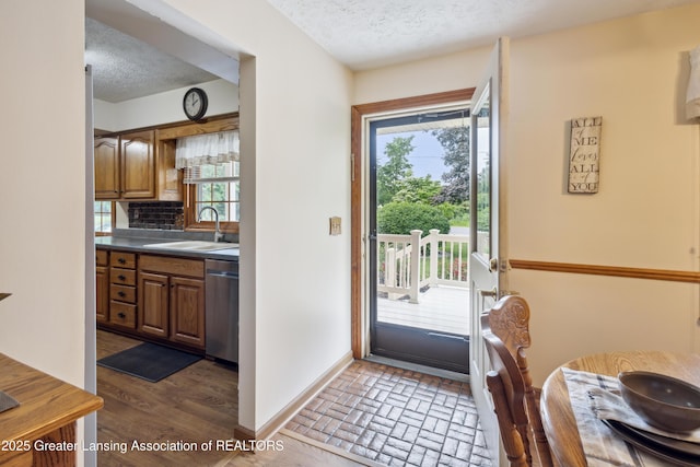 888 S Waverly Rd, Eaton Rapids, MI 48827 - entryway featuring a textured ceiling and healthy amount of natural light