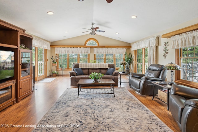 888 S Waverly Rd, Eaton Rapids, MI 48827 - living area featuring ceiling fan, wood finished floors, vaulted ceiling, and recessed lighting