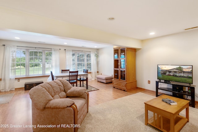888 S Waverly Rd, Eaton Rapids, MI 48827 - living room featuring light wood-style flooring, healthy amount of natural light, and recessed lighting