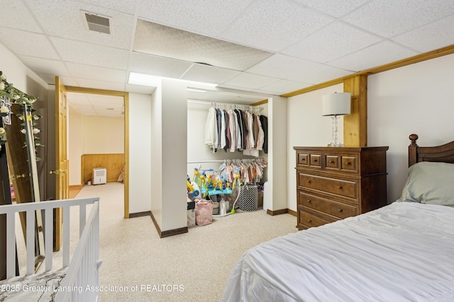 888 S Waverly Rd, Eaton Rapids, MI 48827 - bedroom with a paneled ceiling, a closet, and carpet floors
