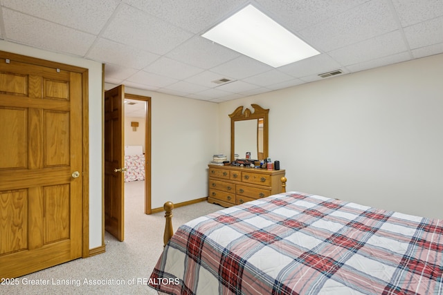 888 S Waverly Rd, Eaton Rapids, MI 48827 - bedroom with light colored carpet and a paneled ceiling