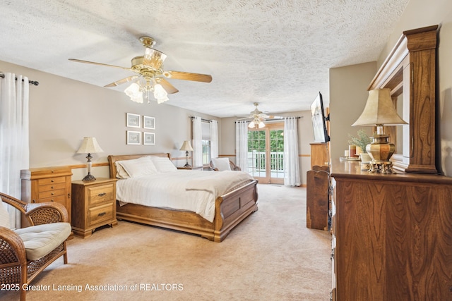 888 S Waverly Rd, Eaton Rapids, MI 48827 - bedroom featuring light carpet, a textured ceiling, and access to outside