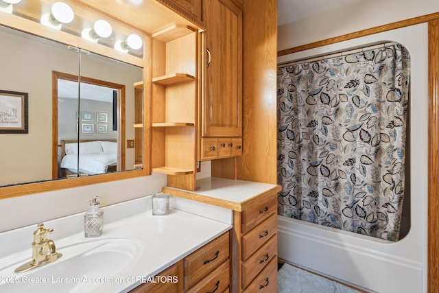888 S Waverly Rd, Eaton Rapids, MI 48827 - bathroom featuring connected bathroom, vanity, and shower / tub combo
