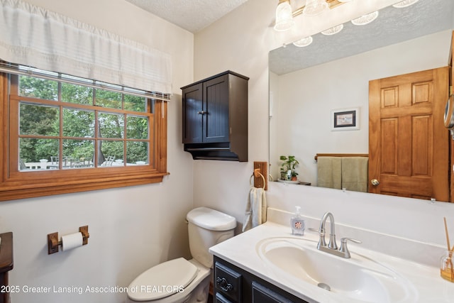 888 S Waverly Rd, Eaton Rapids, MI 48827 - half bathroom featuring vanity and a textured ceiling