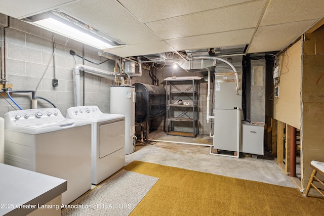 888 S Waverly Rd, Eaton Rapids, MI 48827 - washroom with washer and clothes dryer, water heater, oil tank, and heating unit