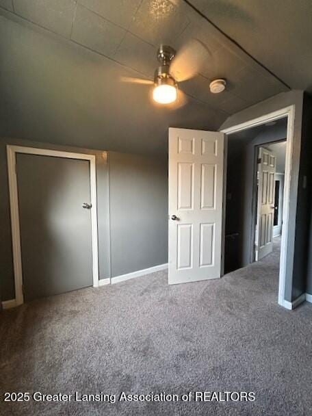 1318 Massachusetts Ave, Lansing, MI 48906 - unfurnished bedroom with carpet floors and vaulted ceiling