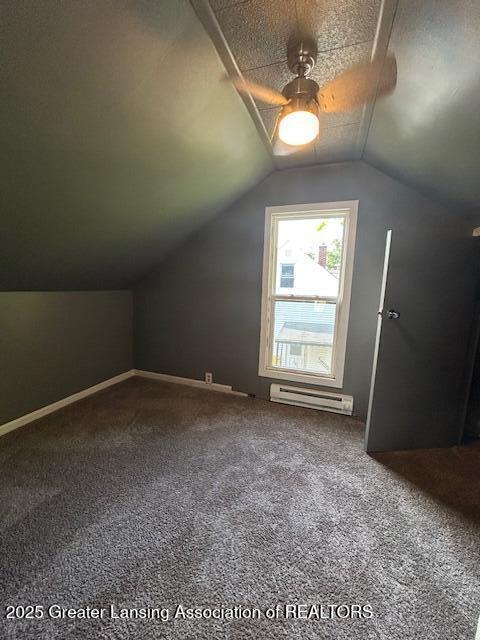 1318 Massachusetts Ave, Lansing, MI 48906 - bonus room featuring ceiling fan, a baseboard heating unit, carpet, and lofted ceiling