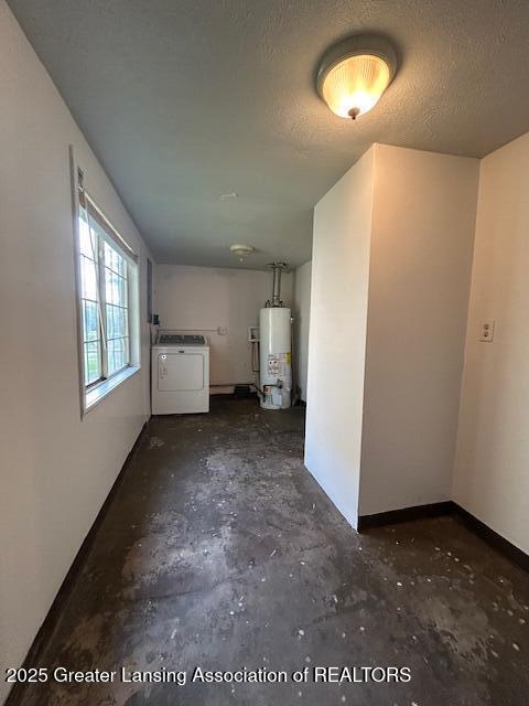 1318 Massachusetts Ave, Lansing, MI 48906 - interior space with water heater, washer / clothes dryer, and unfinished concrete floors