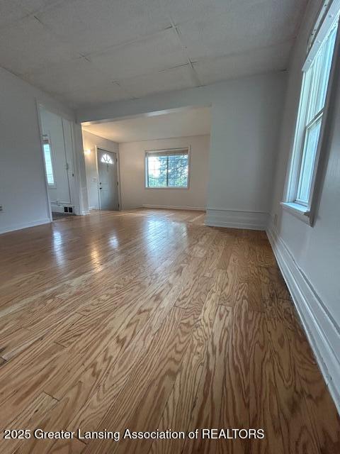 1318 Massachusetts Ave, Lansing, MI 48906 - unfurnished room featuring wood finished floors and baseboards