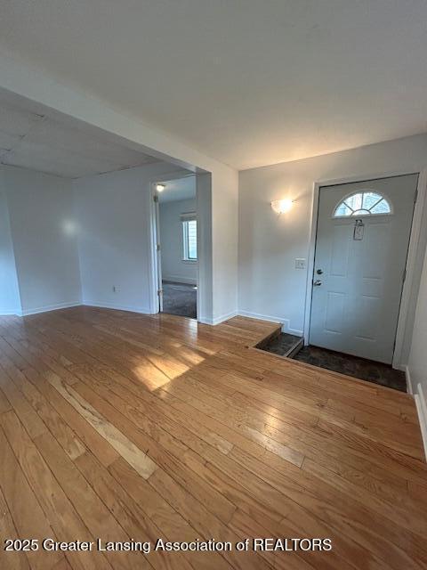 1318 Massachusetts Ave, Lansing, MI 48906 - foyer entrance featuring wood-type flooring and baseboards