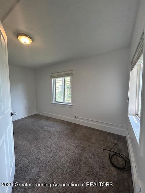 1318 Massachusetts Ave, Lansing, MI 48906 - carpeted spare room with baseboards