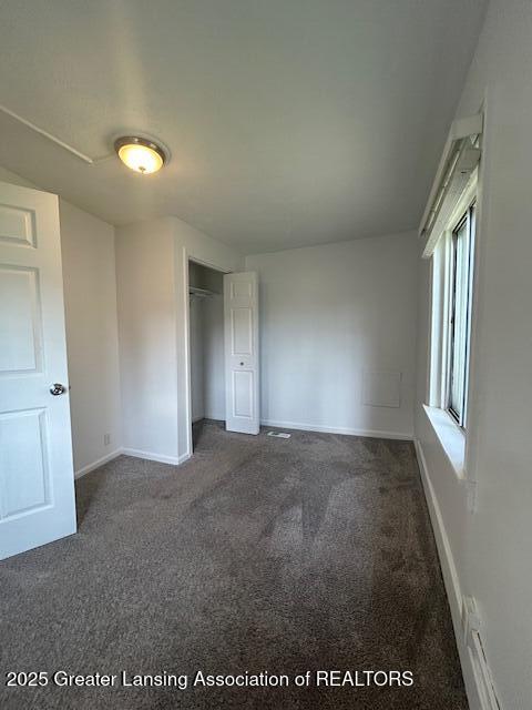 1318 Massachusetts Ave, Lansing, MI 48906 - unfurnished bedroom featuring carpet floors and a closet