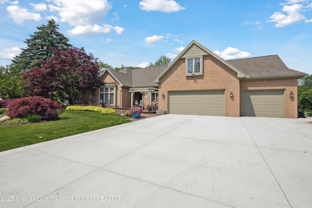 502 W Spring Meadows Ln, Dewitt, MI 48820 - view of front of home featuring brick siding, concrete driveway, a front lawn, a garage, and roof with shingles