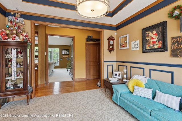 502 W Spring Meadows Ln, Dewitt, MI 48820 - living room featuring wood finished floors, ornamental molding, and carpet floors