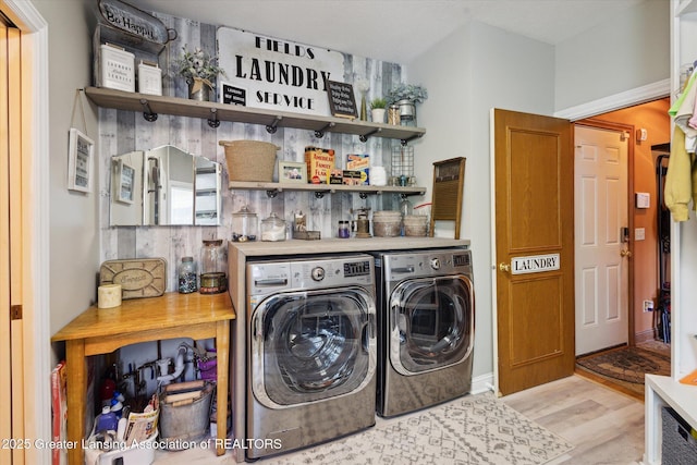 502 W Spring Meadows Ln, Dewitt, MI 48820 - laundry room with washer and dryer and light wood-style flooring