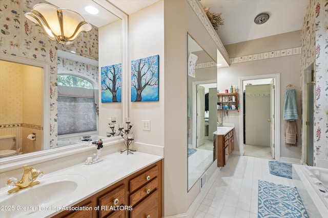 502 W Spring Meadows Ln, Dewitt, MI 48820 - full bathroom with wallpapered walls, vanity, a tub, and tile patterned flooring