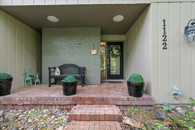 1122 Farwood Dr, East Lansing, MI 48823 - property entrance featuring brick siding