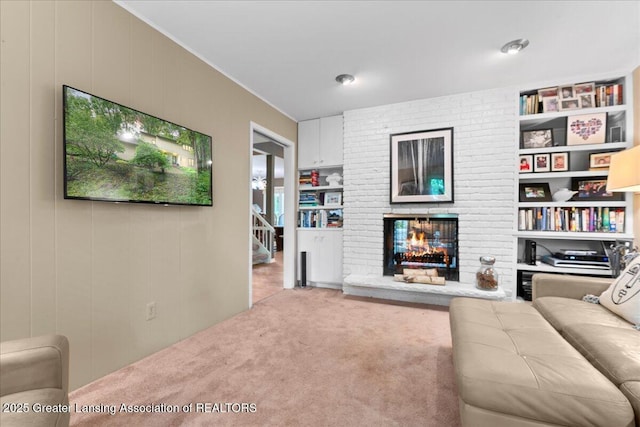 1122 Farwood Dr, East Lansing, MI 48823 - living area featuring carpet, crown molding, a brick fireplace, and built in features