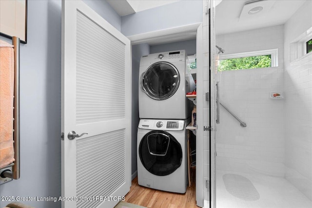 1122 Farwood Dr, East Lansing, MI 48823 - laundry room with estacked washer and dryer and light wood finished floors