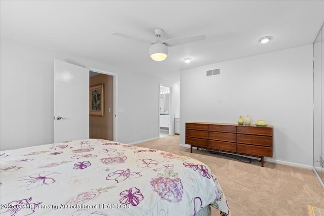 1122 Farwood Dr, East Lansing, MI 48823 - carpeted bedroom with ensuite bathroom and ceiling fan
