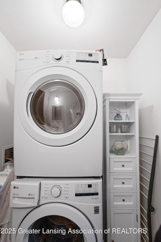 2440 Sower Blvd, Okemos, MI 48864 - laundry area with stacked washer and clothes dryer
