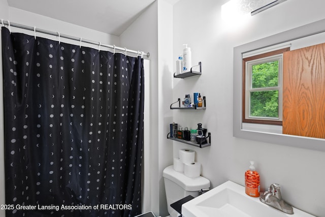 2440 Sower Blvd, Okemos, MI 48864 - full bathroom featuring toilet and curtained shower