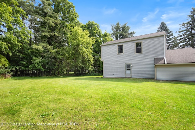 2440 Sower Blvd, Okemos, MI 48864 - back of property featuring a lawn and a shingled roof