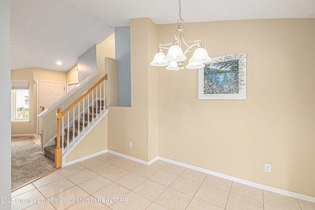 242 Coventry Ln, Mason, MI 48854 - tiled spare room with a chandelier, stairs, recessed lighting, and vaulted ceiling